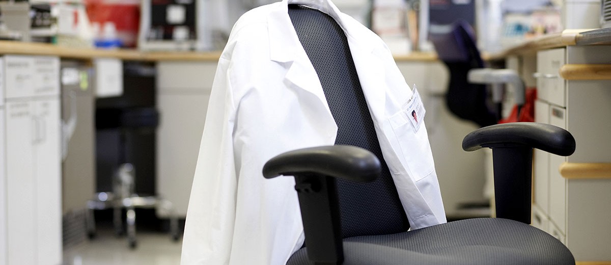 Small business empty chair with lab coat Small business empty chair with lab coat