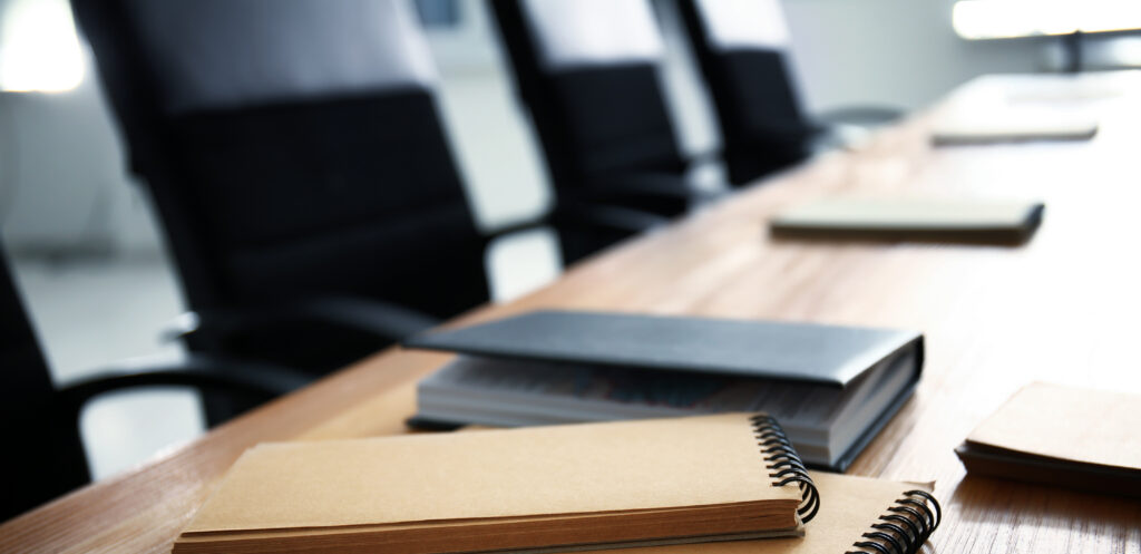Notebooks on table indoors. Business meeting in conference hall