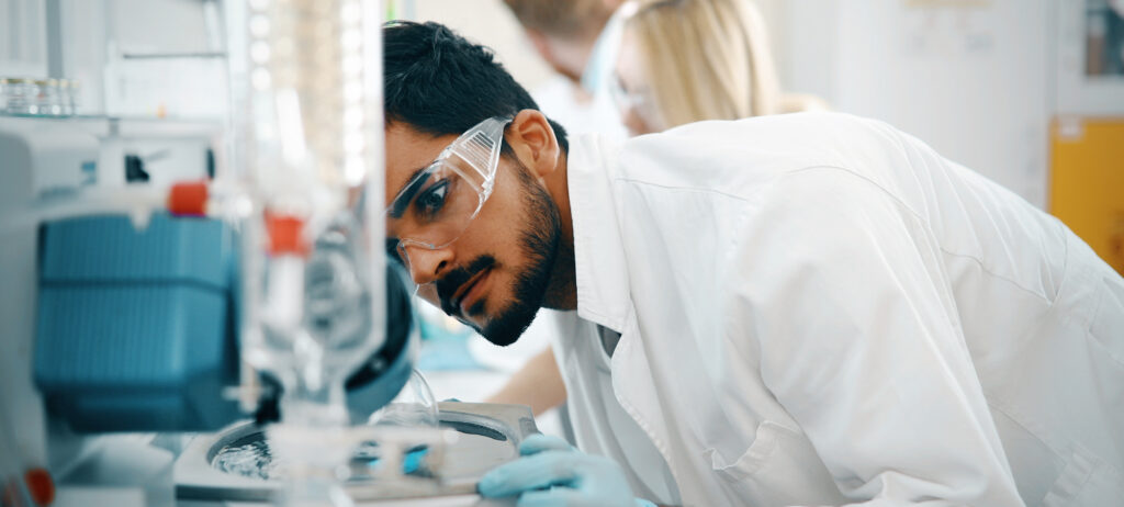 Young students of chemistry working together in laboratory